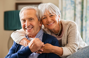 Caregiver supporting senior man at home providing compassionate in-home respite care